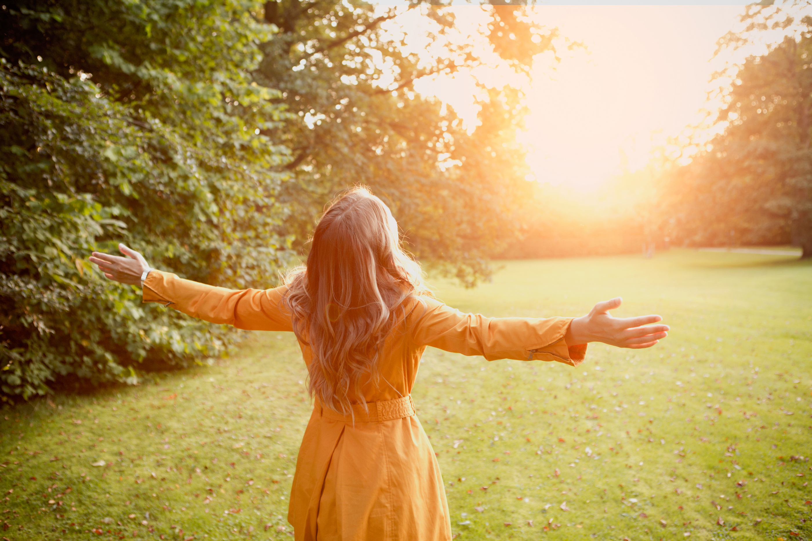 Woman enjoying autumn sun.