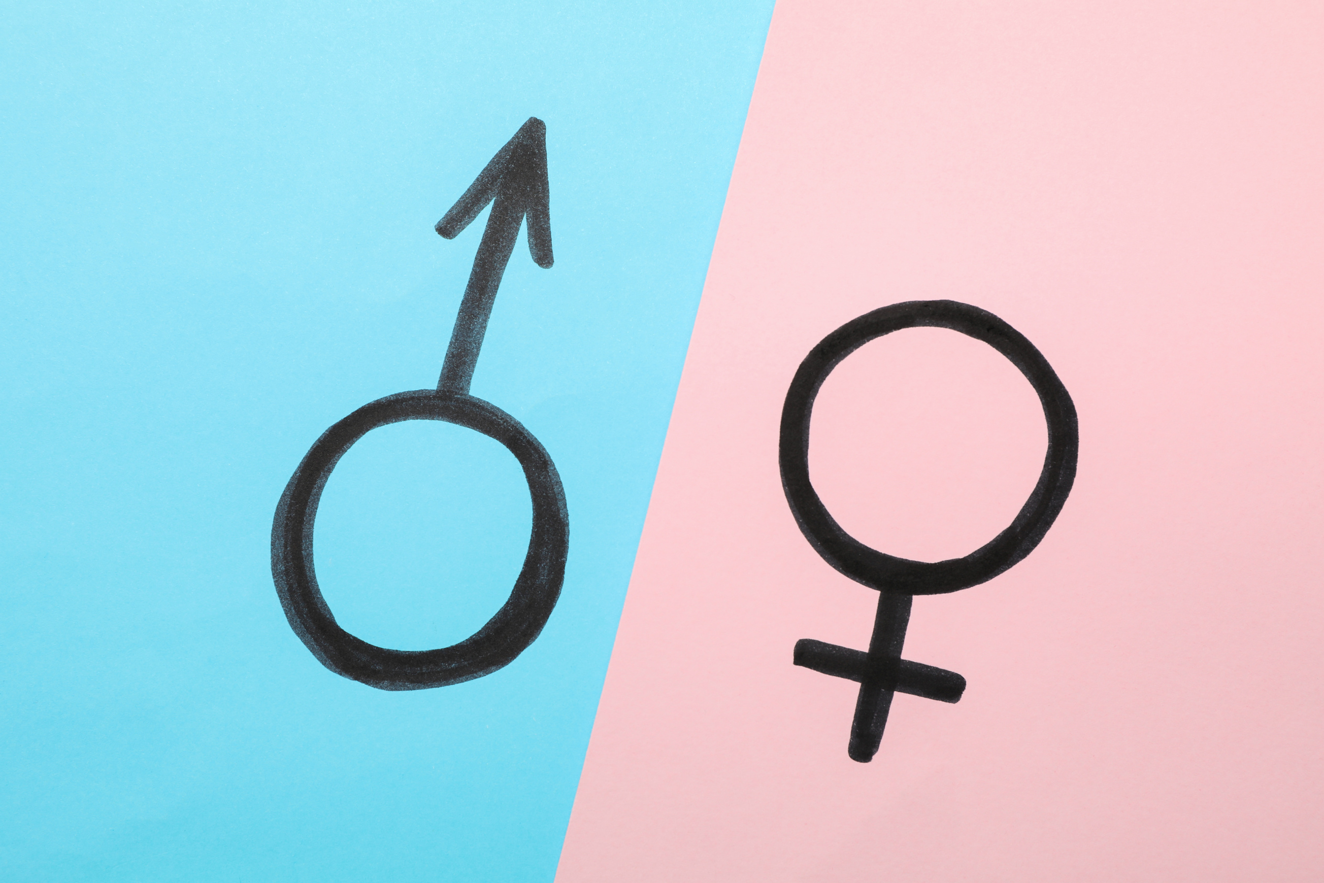 Male and Female Symbols on Two Tone Background