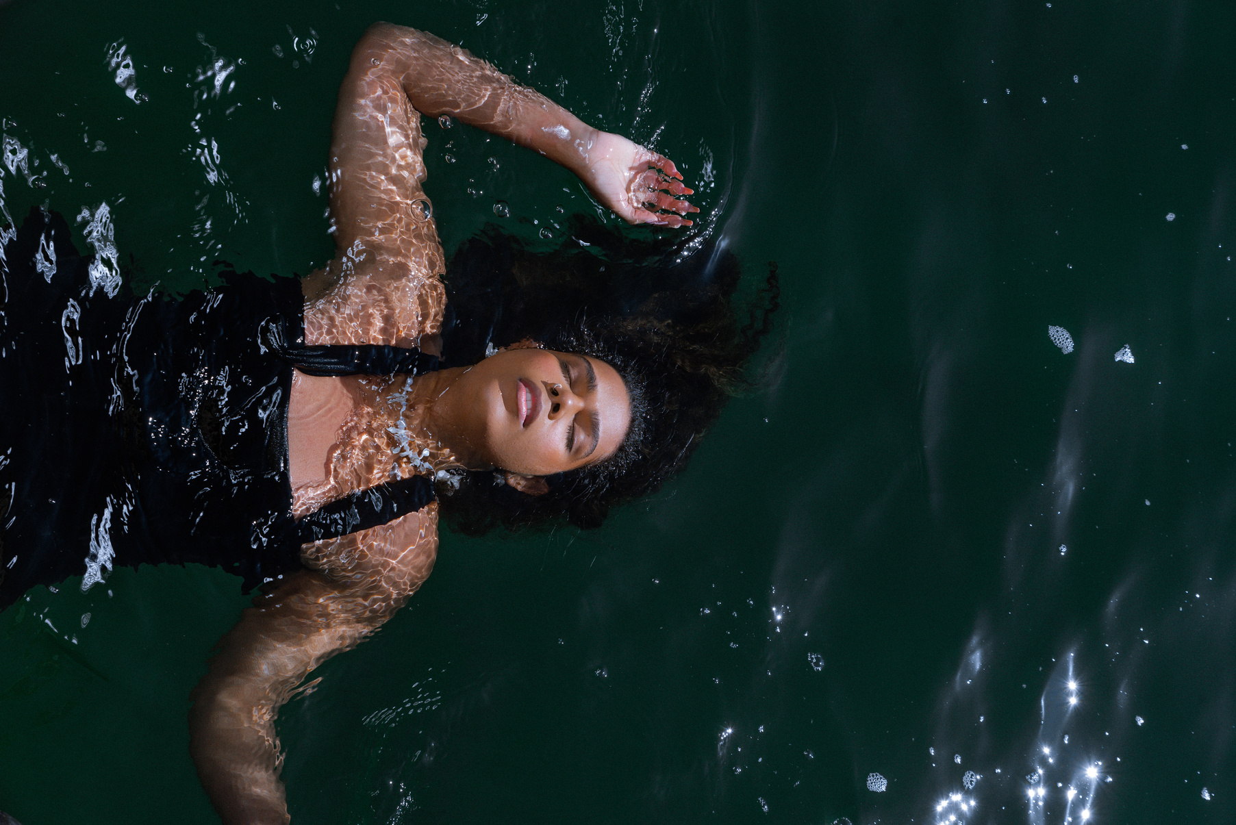 Woman Swimming in Rough Water