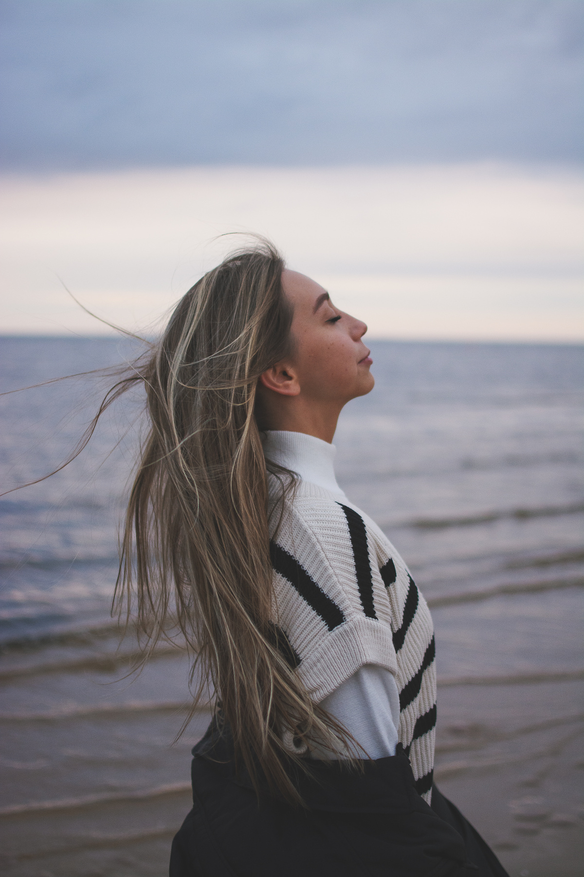 Woman Breathing Fresh Air near Sea