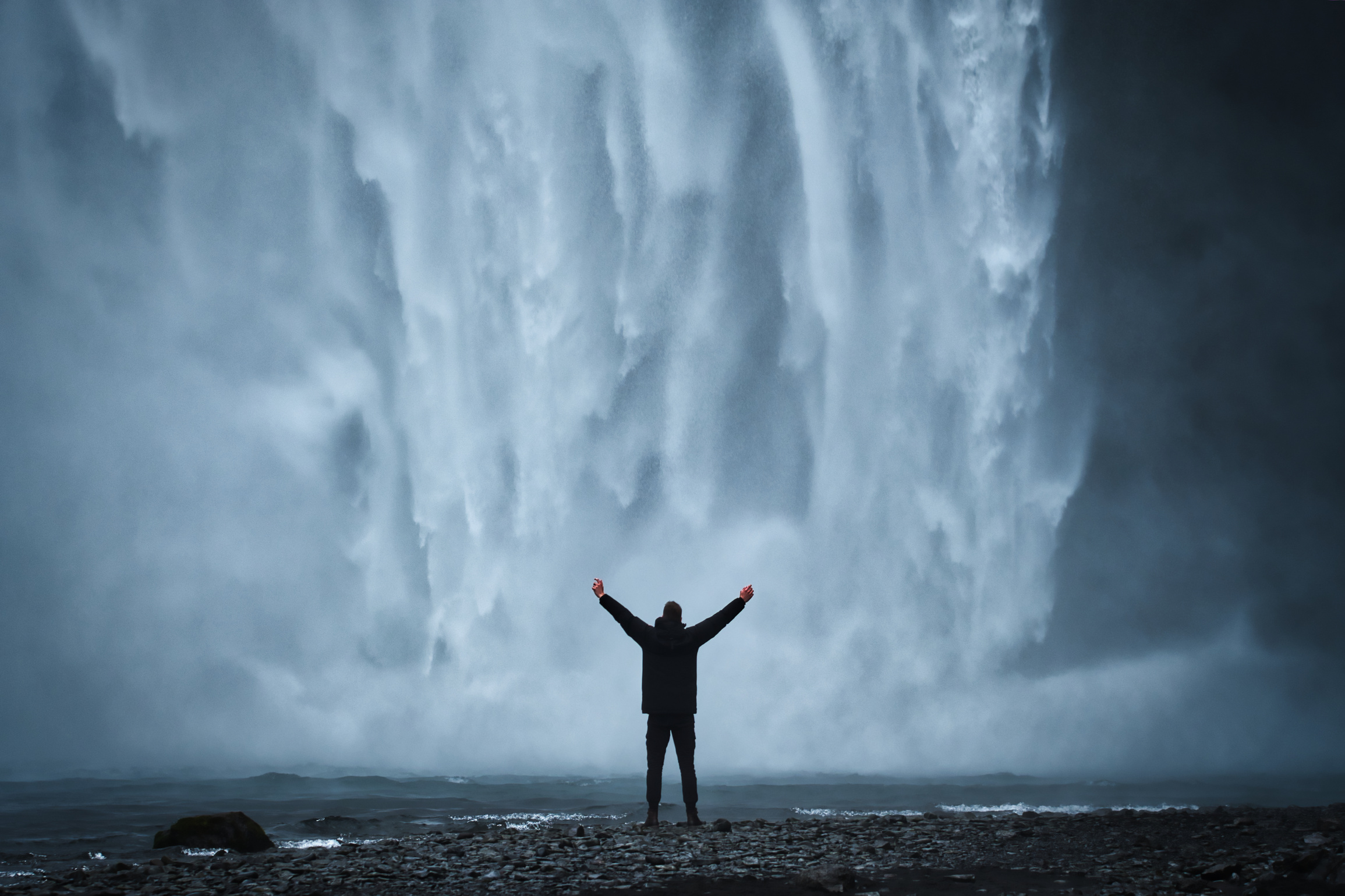 Man by the Waterfall